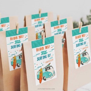 May include: Brown paper gift bags with teal and orange tags. The tags say "Thank You! for Surfing By" and feature a vintage van and surfboard illustration. The text "Love, Grayson" is also included.