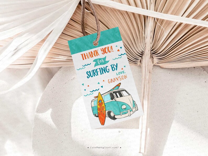 May include: A turquoise blue and white thank you tag with a cartoon illustration of a vintage van with a surfboard on the side. The text on the tag reads "Thank you! for surfing by Love, Grayson".