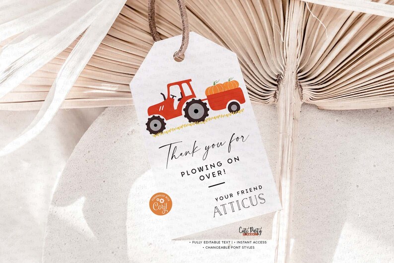 May include: Red tractor with a trailer full of pumpkins. The tractor is on a field of grass. The text on the tag says "Thank you for plowing on over! Your friend Atticus".