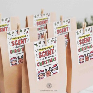 May include: A set of brown paper bags with colorful gift tags that say "Wishing you a Scent-sational Christmas". The tags feature cartoon illustrations of Santa Claus, a reindeer, and a girl.