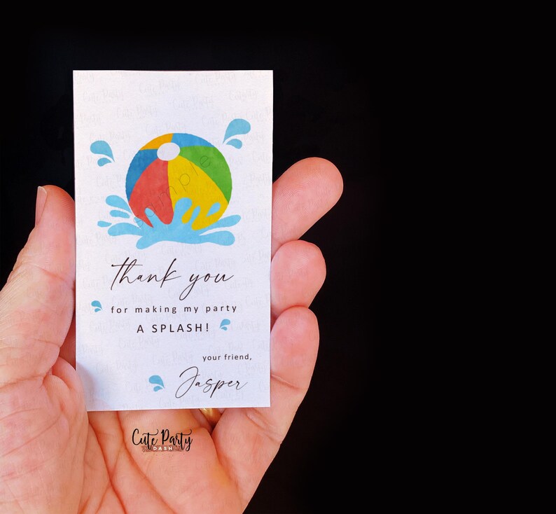 May include: A white party favor tag featuring a beach ball graphic and blue water splashes. The text says "thank you for making my party A SPLASH!" and "your friend, Jasper."