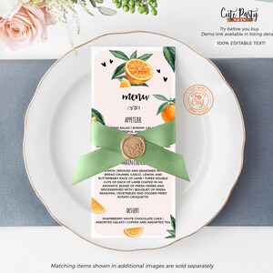 May include: A menu card with an orange and green citrus design, tied with a light green ribbon and a gold wax seal. The menu includes appetizers, main courses, and desserts. The text "Cute Party" is at the top right.