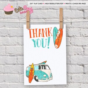May include: A white card with the words "THANK YOU!" in orange and teal. The card features illustrations of surfboards and a teal and white van. The card is held by two wooden pegs against a white brick wall.