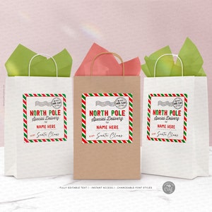 Peut inclure: Trois sacs cadeaux en papier blanc et brun avec des &eacute;tiquettes ray&eacute;es rouge et vert qui disent "North Pole Special Delivery for NAME HERE from Santa Claus".
