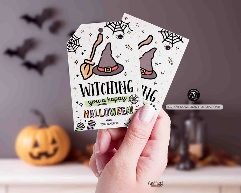 May include: Two Halloween-themed gift tags with a witch hat and broom illustration. The tags read "Witching you a happy Halloween!" with space for a name. The design includes spiderwebs, stars, and potion bottles.