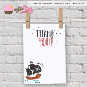 May include: A printable thank you card with a pirate ship illustration. The card is white with red and black text that says "THANK YOU!" and a black and red pirate ship with a skull and crossbones on the sail. The ship is sailing on blue waves.