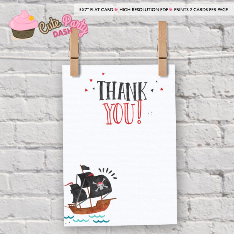 May include: A printable thank you card with a pirate ship illustration. The card is white with red and black text that says "THANK YOU!" and a black and red pirate ship with a skull and crossbones on the sail. The ship is sailing on blue waves.