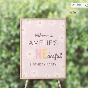 May include: A pink welcome sign with a daisy pattern and the text "Welcome to Amelie's One-derful Birthday Party!"