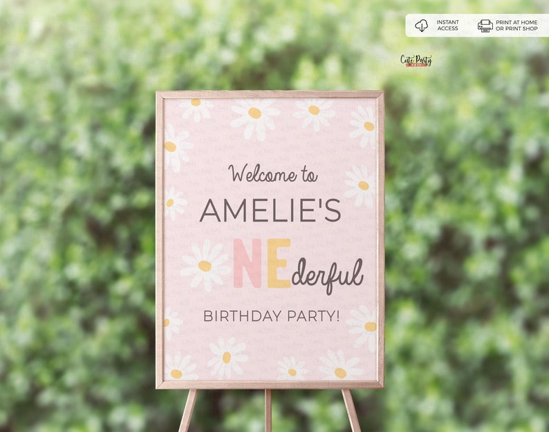 May include: A pink welcome sign with a daisy pattern and the text "Welcome to Amelie's One-derful Birthday Party!"
