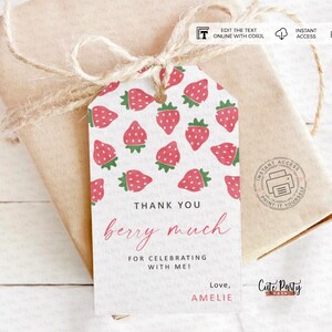 May include: A printable thank you tag with a white background and a pattern of red strawberries. The text reads "Thank you berry much for celebrating with me! Love, Amelie".