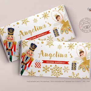 May include: Printable chocolate bar wrapper featuring a watercolour illustration of a nutcracker and a ballerina with gold snowflakes and glitter. The text "Angelina's Second Birthday" is printed on the wrapper.