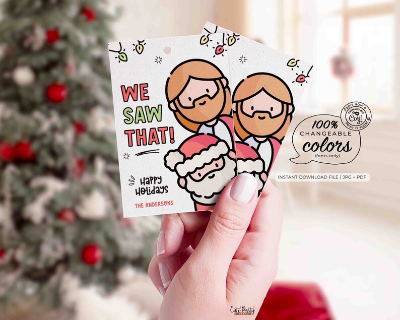 May include: A printable Christmas gift tag featuring a cartoon illustration of three people, two with beards and one with a Santa hat. The tag says "We Saw That!" and "Happy Holidays" with a space for a name. The text "100% Changeable Colors (fonts only)" is also included.