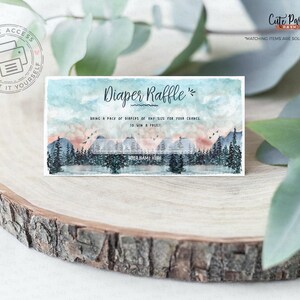 May include: A printable diaper raffle ticket with a watercolor mountain scene. The text reads "Diaper Raffle" and "Bring a pack of diapers of any size for your chance to win a prize".