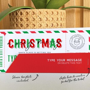 May include: A Christmas gift voucher with red and green accents. The voucher reads "Merry Christmas" in a festive font, with the text "Santa Claus is getting you." It includes a space to type a message and a North Pole stamp.