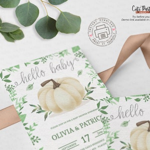 May include: Printable baby shower invitation with a white pumpkin and green foliage. The text "hello baby" is written in a script font. The invitation says "Please join us for a baby shower honoring Olivia & Patrice, September 17".