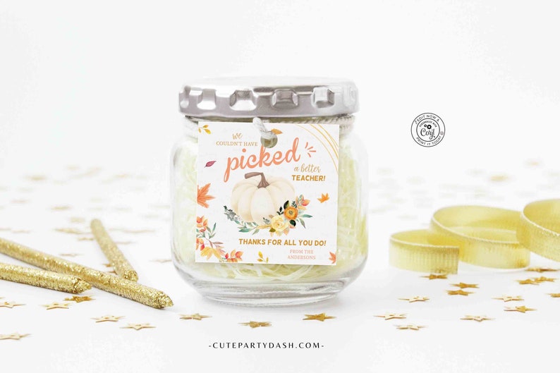 May include: A small glass jar with a white label that says "We couldn't have picked a better TEACHER! Thanks for all you do! From the Andersons - CutePartyDash.com" with a watercolor illustration of a pumpkin and fall leaves.