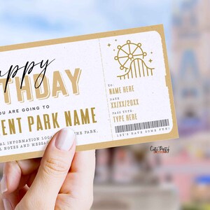 May include: A printable birthday ticket with a gold and white color scheme. The ticket says "Happy Birthday" and "You are going to [Name of amusement park]" with a graphic of a Ferris wheel and roller coaster. The ticket has a space to fill in the name, date, and pass type.