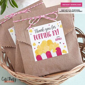 May include: Thank you for popping by!  A printable favor tag with a cartoon image of a popcorn bucket with the text "Thank you for popping by!" and "Love, Sophia".
