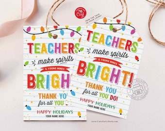 May include: Two printable gift tags with a Christmas lights theme. The tags feature the text "Teachers make spirits & young minds bright!" with a colorful design. The text "Thank you for all you do! Happy Holidays" is also included on the tags.