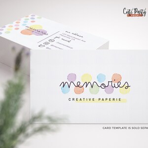 May include: A stack of business cards with a colorful logo that says "memories creative paperie". The logo features a row of colorful circles with the word "memories" written in a script font. The text "Cute Party Dash" is also visible in the top right corner of the image.
