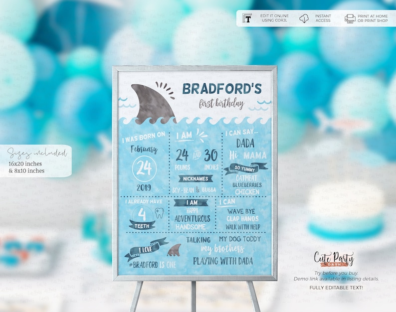 May include: A blue and white printable first birthday sign for a boy featuring a shark fin design. The sign includes the child's name, age, and other details about their first year. The text on the sign reads "Bradford's first birthday".
