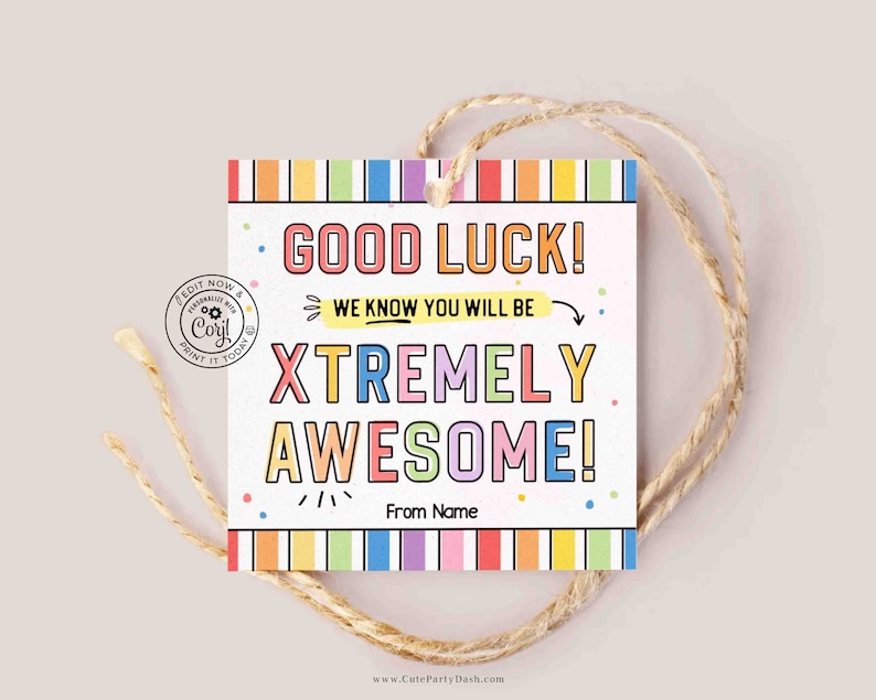 May include: A colorful gift tag with the text "Good Luck! We know you will be XTREMELY AWESOME!" with rainbow stripes and confetti. The tag is tied with twine and has the text "From Name" at the bottom.