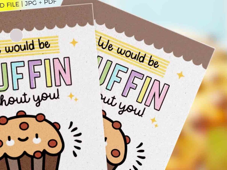 May include: Two gift tags with a cartoon muffin illustration. The tags have the text "We would be MUFFIN without you!" in colorful letters. The top edge of the tags is scalloped, and there are small star accents.