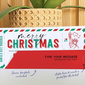 May include: A red and white gift voucher with a green border and the text "merry CHRISTMAS" in red and green letters. The voucher has a pocket for a ticket and a sleeve template included. The voucher also features a small illustration of the Statue of Liberty with the text "I NY" above it.