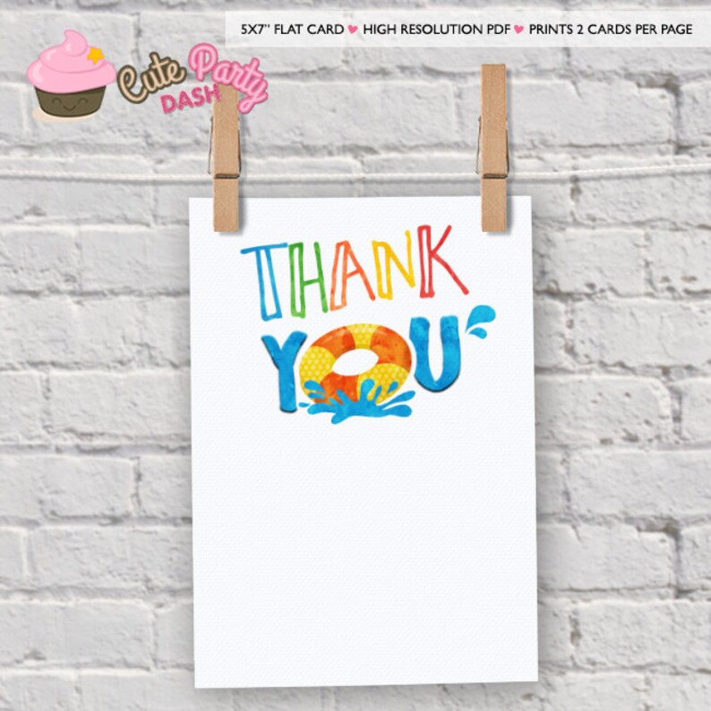 May include: A white card with the words "THANK YOU" in colourful, playful lettering. The "O" in "YOU" is a life preserver. The card is held by two wooden clothes pegs against a white brick wall.