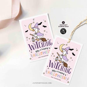 May include: Two pink Halloween gift tags with a witch duck illustration. The tags feature the text "Witching you a happy Halloween!" and include bats, stars, and a crescent moon.
