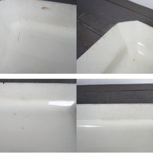 May include: A white enamel baking dish with a rectangular shape. The dish has a slightly worn surface with some scratches.