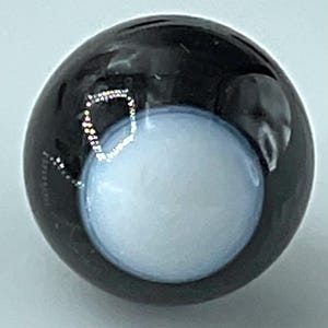 May include: A handmade wooden sign with the text "Welcome" in a handwritten style. The sign is painted white with a distressed finish and features a decorative floral design in shades of pink and green. It is designed for indoor or outdoor use.