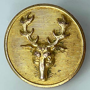 May include: A set of three ceramic mugs with a speckled, matte finish. The mugs are in shades of cream, light gray, and dark gray. Each mug has a simple, minimalist design, perfect for coffee or tea.