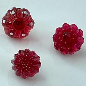 May include: A set of three ceramic mugs with a speckled, matte finish. The mugs are in shades of cream, light gray, and dark gray. Each mug has a simple, minimalist design, perfect for coffee or tea.