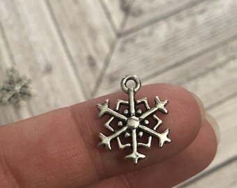 11 silver snowflake charms
