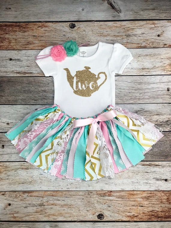 mint and gold outfit
