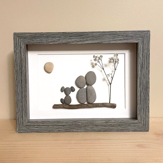 Pebble art couple with cheap dog
