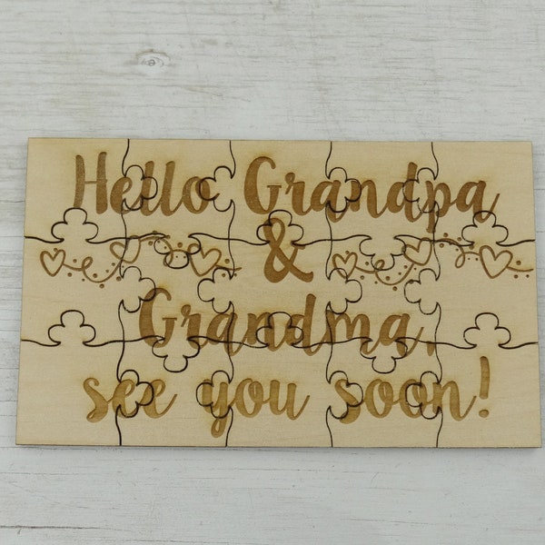 May include: A wooden jigsaw puzzle with the text "Hello Grandpa & Grandma, see you soon!" and a string of hearts.