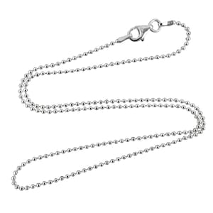 May include: A silver ball chain necklace with a lobster clasp.