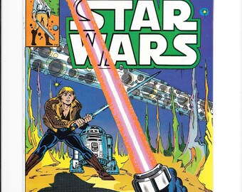 May include: A vintage Star Wars comic book cover. The cover features the title "Star Wars" in large green letters. The artwork depicts a lightsaber duel with Luke Skywalker and R2-D2. The comic is labeled "Marvel Comics Group".