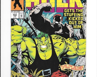 May include: The Incredible Hulk comic book issue 402, dated February 1992, features a green-skinned Hulk in a black tank top and red pants in a jungle setting. The cover text reads: The Incredible Hulk Gets The Stuffing Kicked Out Of Him!