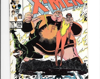 May include: The Uncanny X-Men comic book issue 206, dated June, featuring a cover illustration of a large character holding a smaller figure, a character in a green suit, and a metallic character lifting a heavy dark slab of debris.