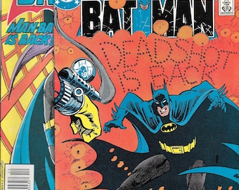 May include: Three vintage Batman comic books. The covers feature Batman in a blue and black costume, with the title "Batman" in bold letters. One cover reads "Deadshot is Back!" and another says "Man-Bat is Back!"