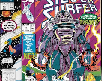 May include: Two Marvel Comics Silver Surfer issues, number 81 and 82. Issue 82 features a large, armored, purple and teal character named Tyrant standing over fallen figures. The cover text reads The Silver Surfer, Who Can Stand Against The Power Of Tyrant, and lists various character names.