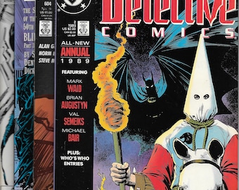 May include: A comic book cover featuring a black and white illustration of Batman and a hooded figure riding a white horse. The comic book is titled "Detective Comics" and is the 1989 annual issue. The cover features the text "All-New Annual 1989" and "Featuring Mark Waid, Brian Augustyn, Val Semeiks, Michael Bair".