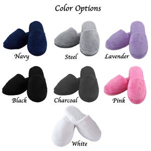 May include: A variety of colors of fuzzy slippers are shown. The colors include navy, steel, lavender, black, charcoal, pink, and white.