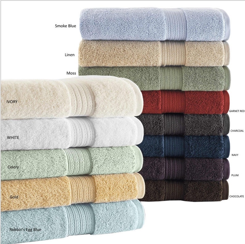 May include: A stack of ten bath towels in various colors, including ivory, white, celery, gold, robin's egg blue, smoke blue, linen, moss, garnet red, charcoal, navy, plum, and chocolate.