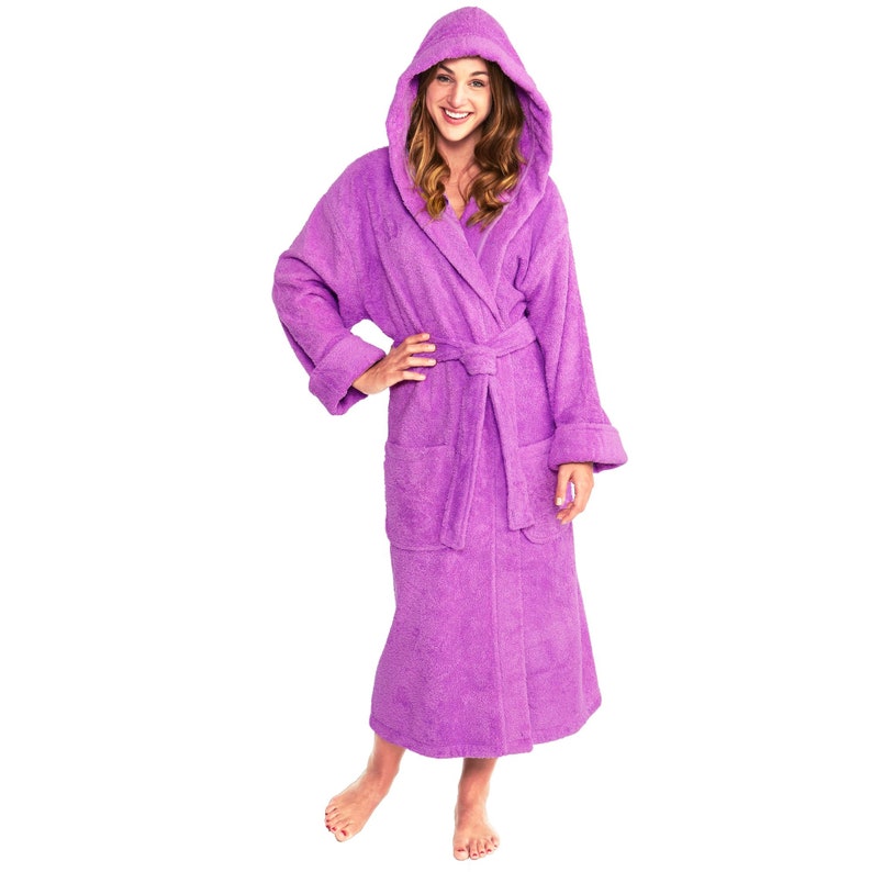 May include: A purple hooded bathrobe with a tie belt and pockets. The robe is made of soft, absorbent terry cloth.