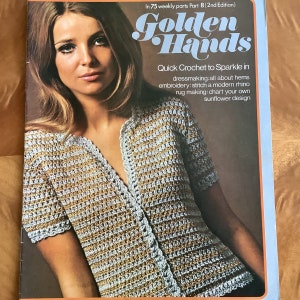 May include: A magazine cover featuring a woman wearing a crocheted top with a gold and white pattern. The magazine is titled "Golden Hands" and features the text "Quick Crochet to Sparkle in dressmaking: all about hems embroidery: stitch a modern rhino rug making: chart your own sunflower design".