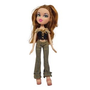 May include: A Bratz doll with auburn hair and green eyes. The doll wears a dark blue corset top with tan accents and brown plaid pants. The doll is wearing pink platform shoes.